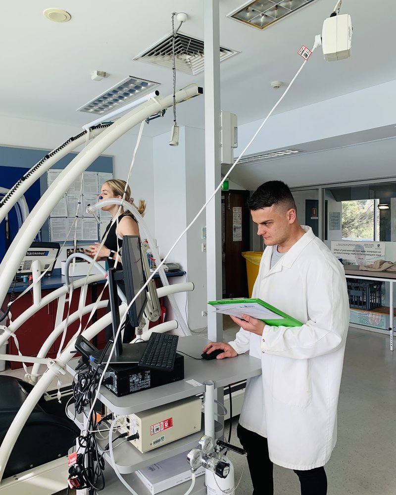 Dr Cory Dugan recording data during an exercise-physiology trial.